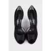 Black shoes decorated with rhinestones