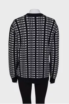 Black and white sweater with brand logo