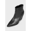 Black сossacks with a pointed toe