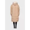 Beige-coloured down jacket. 