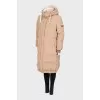 Beige-coloured down jacket. 