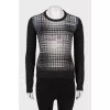Sweater with perforations and rhinestones