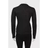 Sweater with perforations and rhinestones