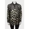 Translucent shirt with golden embroidery