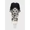 Dress with decorated hem and sleeves