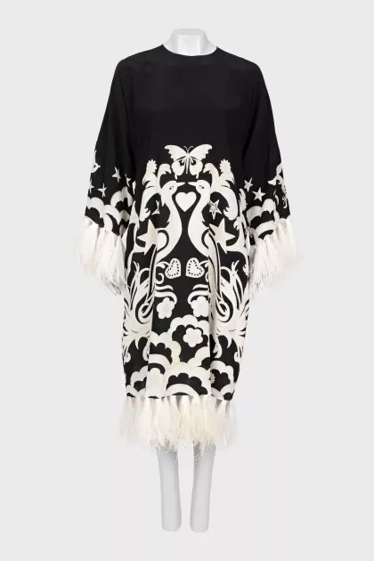 Dress with decorated hem and sleeves