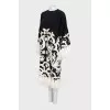 Dress with decorated hem and sleeves