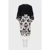 Dress with decorated hem and sleeves