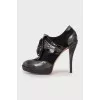 Embellished ankle boots with perforations