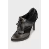 Embellished ankle boots with perforations