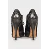 Embellished ankle boots with perforations