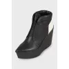 Perforated wedge boots