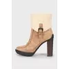 Suede ankle boots with fur heel