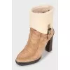 Suede ankle boots with fur heel