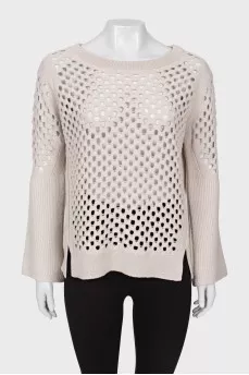 Wool sweater with perforations