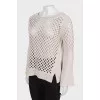 Wool sweater with perforations