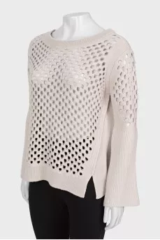 Wool sweater with perforations