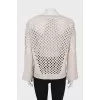 Wool sweater with perforations