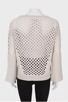 Wool sweater with perforations