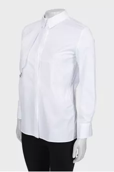 White shirt with decor on the chest