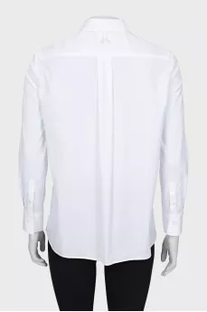 White shirt with decor on the chest