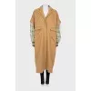 Beige coat with printed sleeves