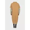Beige coat with printed sleeves