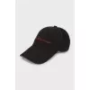 Black cap with embroidered brand logo