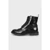 Black boots with perforated leather