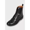 Black boots with perforated leather