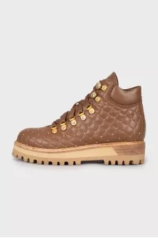Insulated boots with gold hardware
