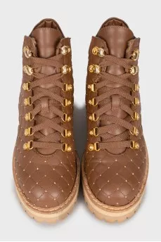 Insulated boots with gold hardware
