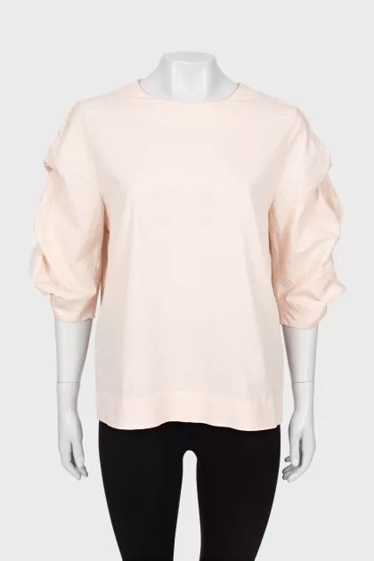 Pink blouse with voluminous sleeves