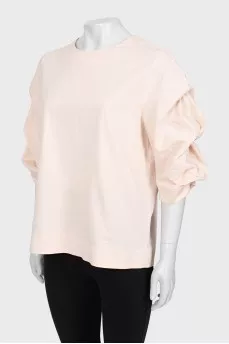 Pink blouse with voluminous sleeves