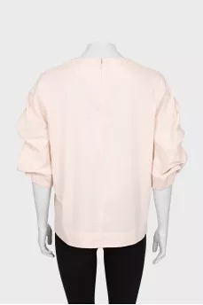Pink blouse with voluminous sleeves