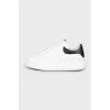 Men's black and white leather sneakers