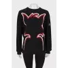 Black sweater with seams facing out