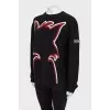 Black sweater with seams facing out
