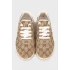 Textile sneakers in a signature print