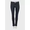 Blue jeggings with gold hardware