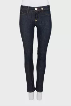 Blue jeggings with gold hardware