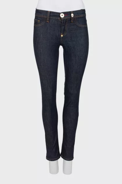 Blue jeggings with gold hardware