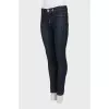 Blue jeggings with gold hardware