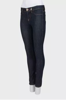 Blue jeggings with gold hardware
