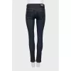 Blue jeggings with gold hardware