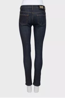 Blue jeggings with gold hardware