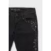 Black jeans with metallic rhinestones