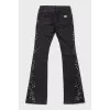 Black jeans with metallic rhinestones