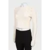 Cashmere sweater decorated with rhinestones