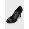 Suede shoes decorated with a bow